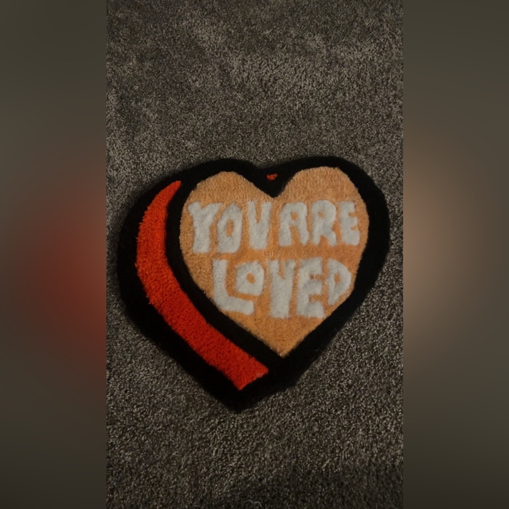 a candy shaped heart💗💗 motivational message “you are loved”